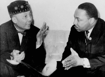 Dr. Martin Luther King, Jr., right, pictured in his first meeting with Elijah Muhammad, left, head of the Black Muslims, said February 24, 1966, in Chicago, IL, his visit does not mean they have a common front. King said Elijah Muhammad agreed a movement is needed against slum conditions. Photo: AP/Wide World photos
