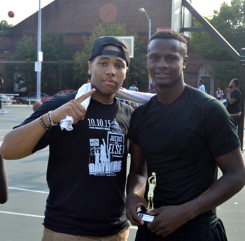 Isaiah Muhammad poses with the winner of the Dunk Contest in Baltimore's Ballin' 4 Justice. 